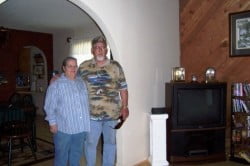 Mom and Dad posing at Cindy's previous house