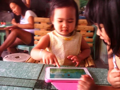Samantha mastering a tablet